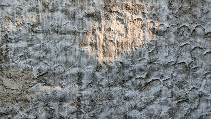 Abstract gray color painted on the rough surface of grunge concrete stucco wall