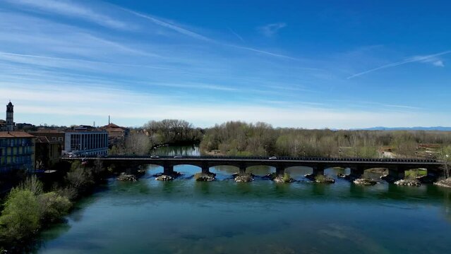 Panoramic view of Adda river bridge, the city of Lodi and and mountains on the horizon