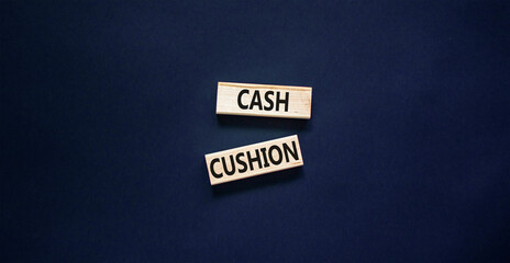 Cash cushion symbol. Concept words Cash cushion on beautiful wooden block. Beautiful black table black background. Business and Cash cushion concept. Copy space.