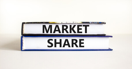 Market share symbol. Concept words Market share on beautiful books. Beautiful white table white background. Business and Market share concept. Copy space.
