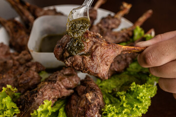 Barbecue - Grilled lamb shoulder with pesto sauce