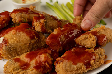 Petisco - Chicken wing seasoned and breaded with sour cream and spicy sauce