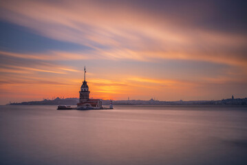 Fototapeta na wymiar Maiden's Tower, built on an island in the Bosphorus, one of the architectural symbols of Istanbul and Turkey, and its photographs taken at sunset in different lights and colors