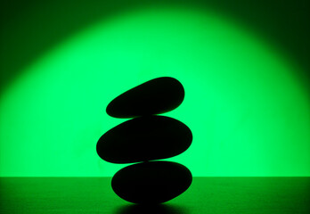 zen stones on green background