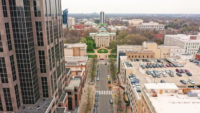 Aerial establishing shot of the North Carolina State Capitol. The North Carolina State Capitol is located in the state capital of Raleigh on Union Square at One East Edenton Street