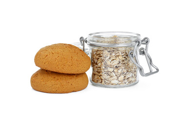 Delicious oatmeal cookies and flakes on white background
