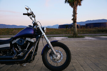 Fototapeta na wymiar Modern black motorcycle parked near road outdoors