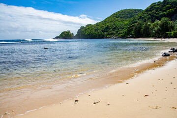 Shore and hills in Amanave village, American Samoa