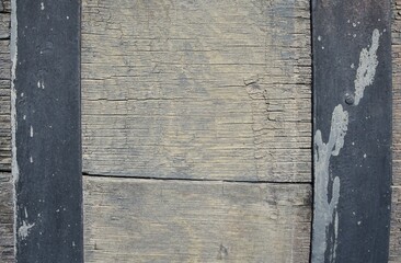 Close up background image of a dry and cracked wooden barrel