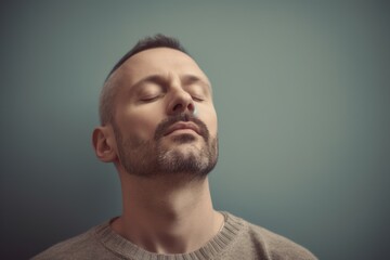 Fototapeta premium Portrait of a bearded man with closed eyes and closed eyes. Toned.