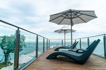 bed pool with umbrella around swimming pool