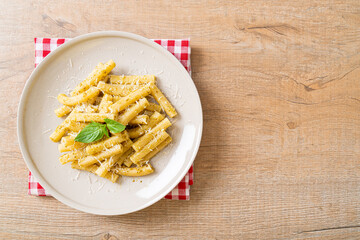 pesto rigatoni pasta with parmesan cheese
