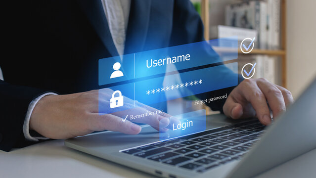 Businessman use laptop login register username and password identity on virtual screen of cyber security, data protection and secured internet access, cybersecurity.