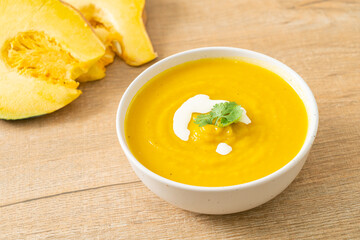 pumpkin soup in white bowl