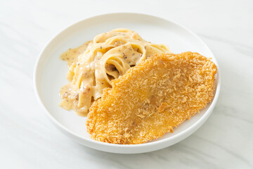 fettuccine pasta white cream sauce with fried fish