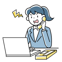 パソコンを見ながら怒った表情で電話対応するビジネスウーマン