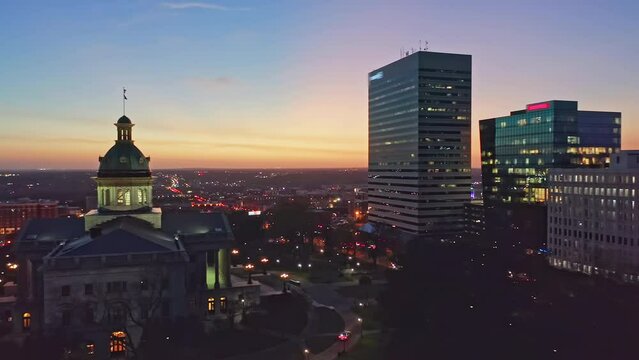 Aerial establishing shot of the South Carolina State House and Columbia skyline at night. The South Carolina State House is the building housing the government of the U.S. state of South Carolina