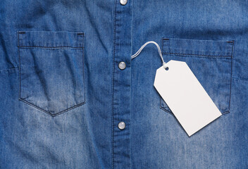 Blue denim shirt with blank white price tag