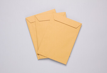 Craft postal envelopes on a gray background