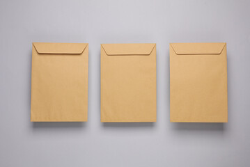 Craft postal envelopes on a gray background