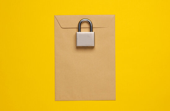 Top secret. Envelope with lock on yellow background