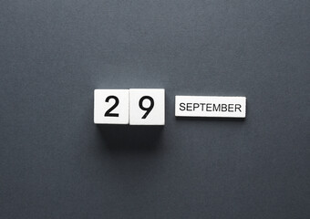 White wooden block calendar with date september 15 and pencil on beige background. Business, deadline, planning