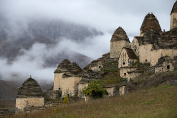 A fragment of the ancient burial complex of Dargavs in the mountain landscape. North Ossetia-Alania, Russia