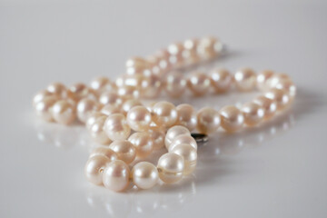 Beautiful White Pearls necklace on white background,