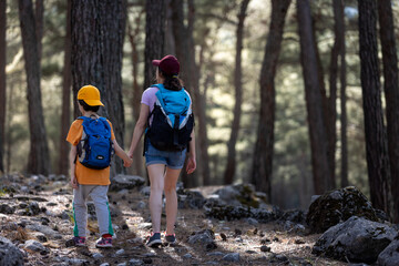 Family lifestyle, mother and son, child outdoors on a hike, travel, vacation together with the child.