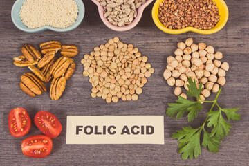 Inscription folic acid, healthy nutritious products or ingredients as source natural vitamin B9, dietary fiber and other minerals