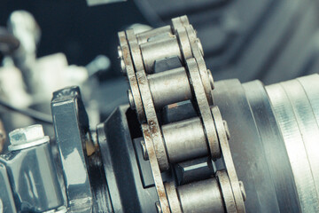 Metal chain and gear in agricultural or industrial machine. Technology