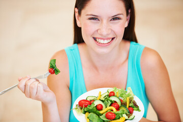 Woman, portrait and eating a healthy salad with vegetables, nutrition and health benefits. Face of a happy female person on a nutritionist diet with vegan food for weight loss, wellness or detox
