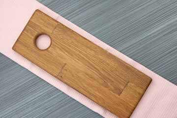 Pink tea towel on anthracite board