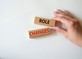 Role changes symbol. Concept words Role changes on wooden blocks. Beautiful white background. Businessman hand. Business and Role changes concept. Copy space.
