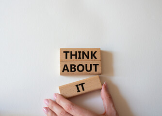 Think about it symbol. Wooden blocks with words Think about it. Beautiful white background....