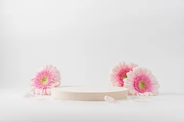 Poster Wooden round podium pedestal cosmetic beauty product presentation empty mockup on  white background with gerbera flowers © Anna Puzatykh
