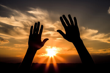 Christian religious concept. Silhouette Hands touching reaching for sunset with glow and ray of the sun. crucifixion pray, Biblical bible theme concept