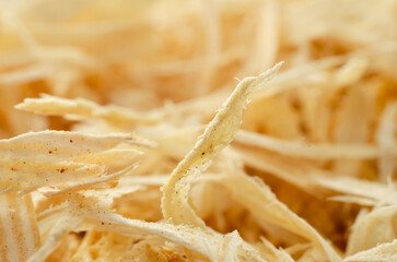 Wood sawdust, background, texture, top view. Pile of sawdust, background. Heap of wood shavings,...
