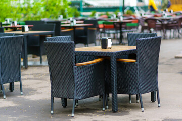 Empty outdoor cafe in early spring cloudy day