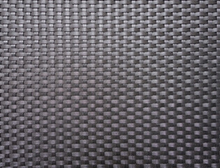 black plastic woven texture background, plastic weave structure with rough surface of chair back or...