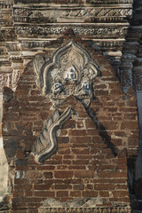 Stucco pattern on the pediment on the edge of the entrance door at Phra Prang Wat Nakhon Kosa in Lopburi , Thailand. Announced the registration of national important historical sites. 