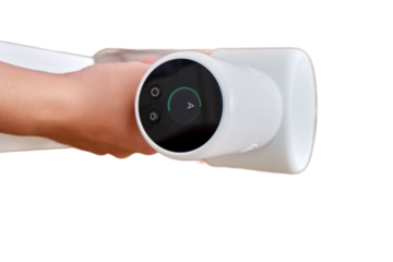 Women hands and display control wireless portable vacuum cleaner in the kitchen, isolated on a white background. A woman cleans the floor in an apartment with a vacuum cleaner with a battery