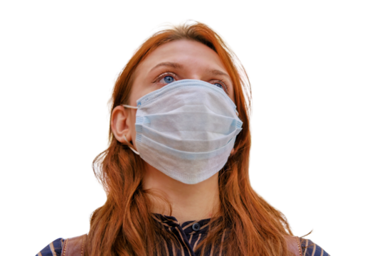 Portrait of a red-haired woman in a mask on a background of street lights in bokeh, isolated on a white background. Woman face in medical mask, close up