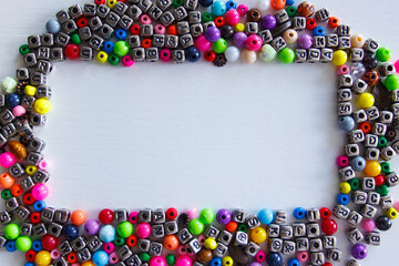 Background from different colored beads with numbers and symbols