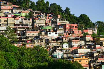 Fototapeta premium A colorful favela overlooking the Atlantic ocean in Rio de Janeiro. Beautiful sunrise view to favela on hillside in Rio de Janeiro.