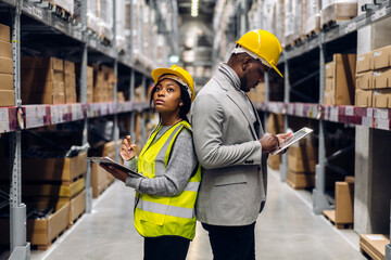 Portrait african american engineer team shipping order detail on tablet export and import,goods,factory,warehouse,international trade,transportation,cargo ship,logistic,distribution.business industry