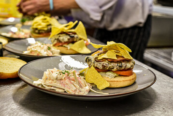 Chef working in busy kitchen preparing meals