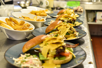 Chef working in busy kitchen preparing meals