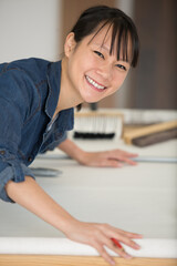 happy woman doing refurbishment at home