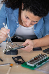 woman mobile phone repair in workshop